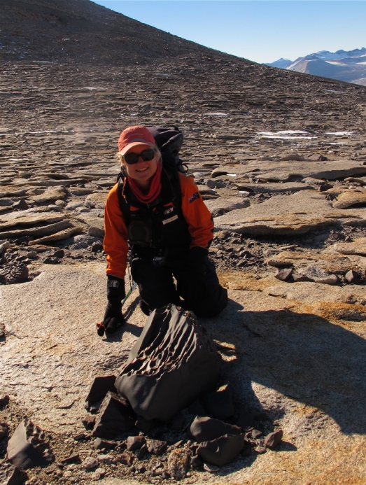 Me in Geological Heaven!Beautiful Dolerite ventifact perched on a granite slab. 